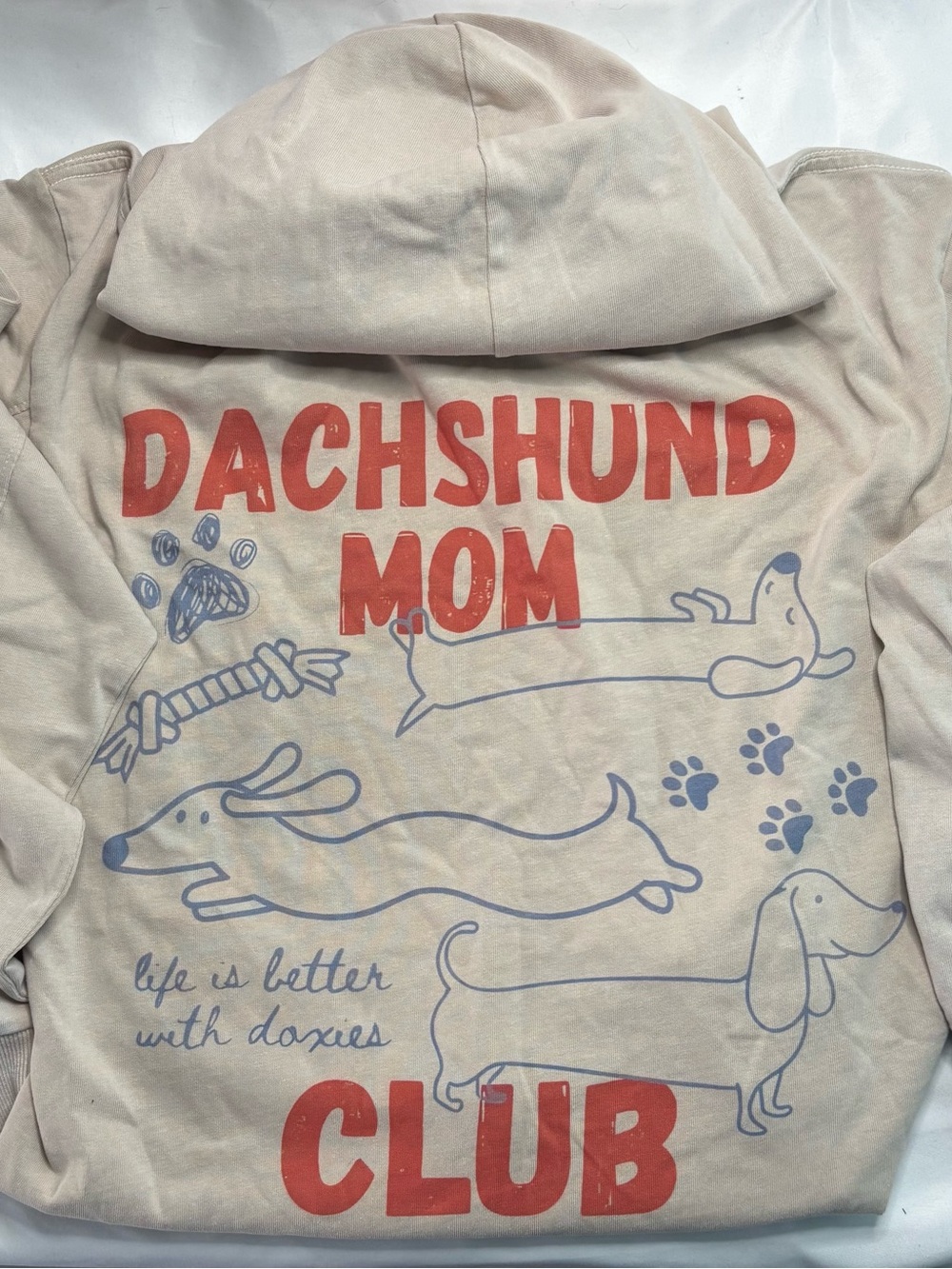 Dachshund Mom Club Hoodie - Cream with Red & Blue Print